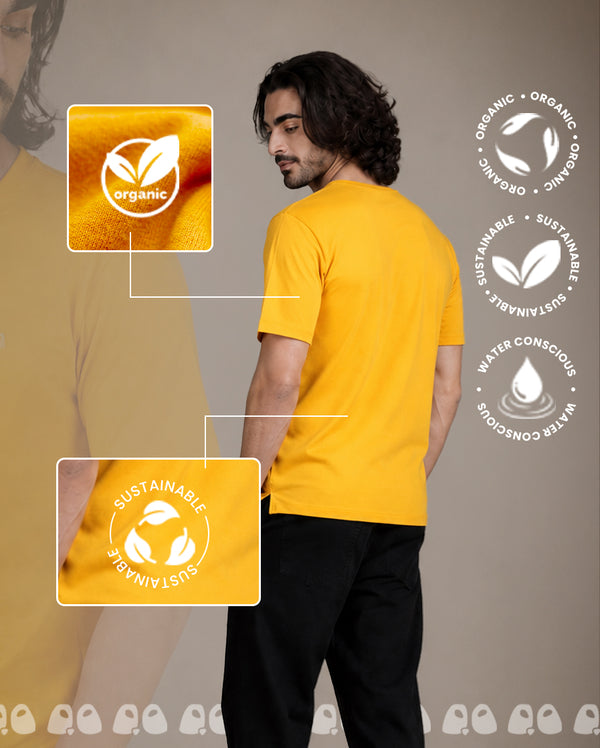 A man wearing a bright yellow short-sleeve t-shirt is shown from the back against 